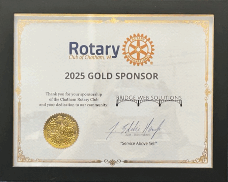 May show: Framed certificate naming Bridge Web Solutions as a 2025 Gold Sponsor of the Chatham Rotary Club, signed and featuring a gold seal.