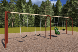 May show: A playground swing set with four standard swings, one green adaptive swing, and one black bucket swing, set on a mulch surface with trees in the background.