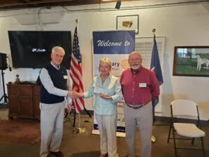 May show: A group of people shaking hands.